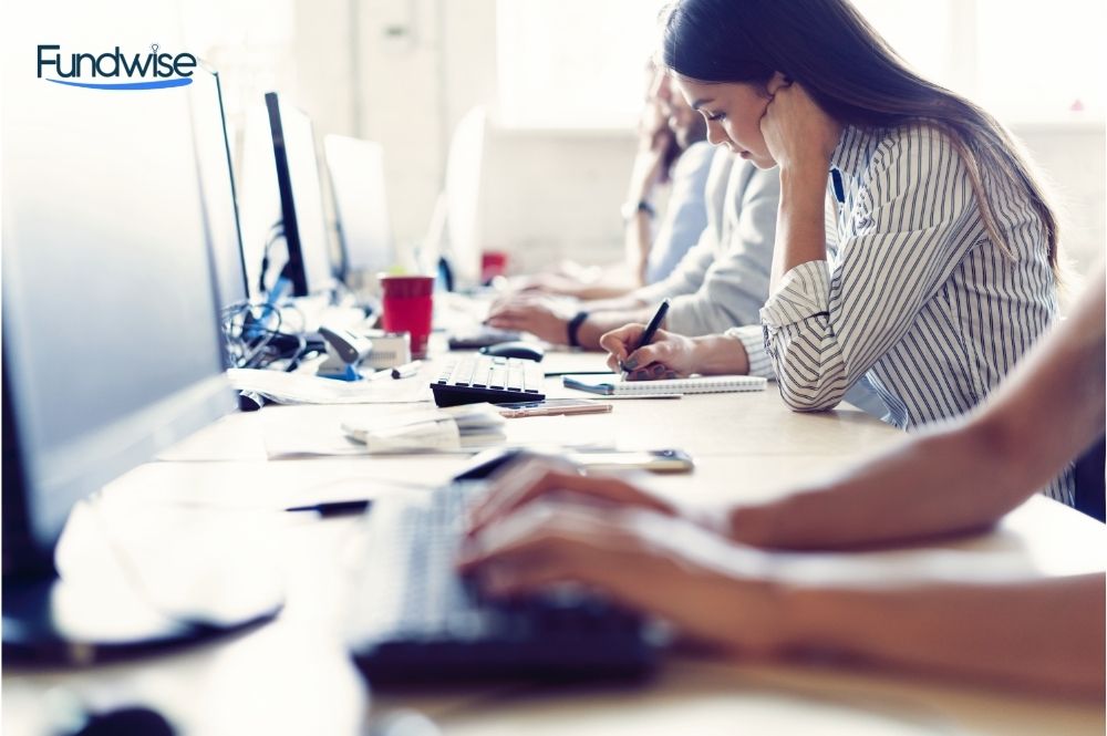 Image of Female Hands Typing on Keyboard in Working Environment