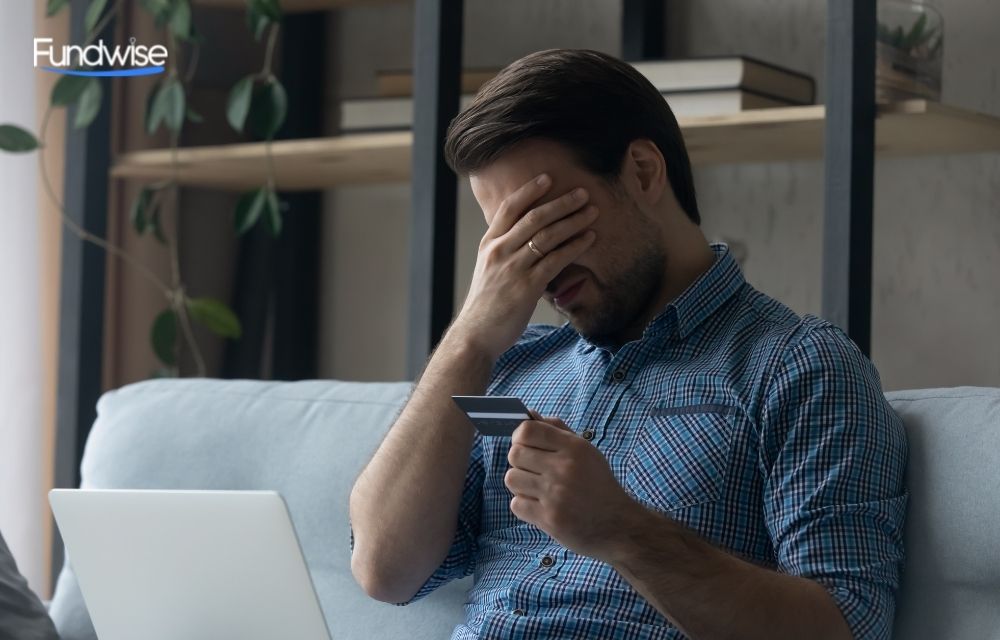 worried businessman in front of laptop