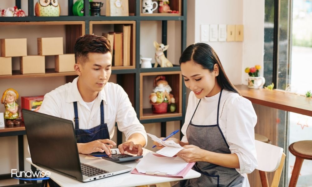 business owners checking invoices