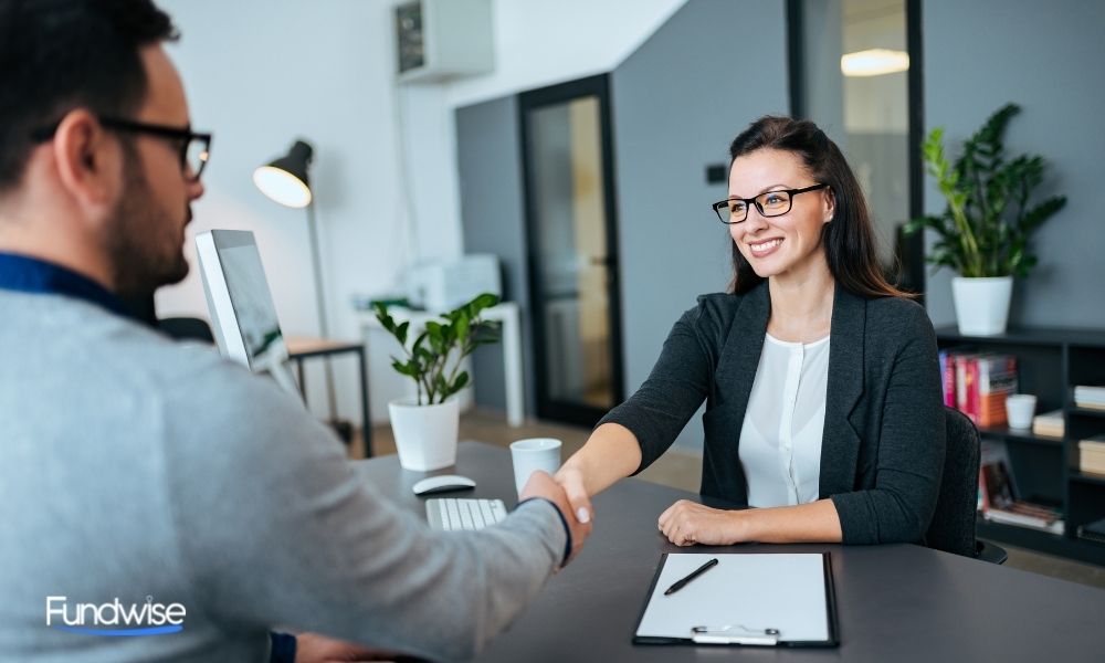 business owners shaking hands in the office