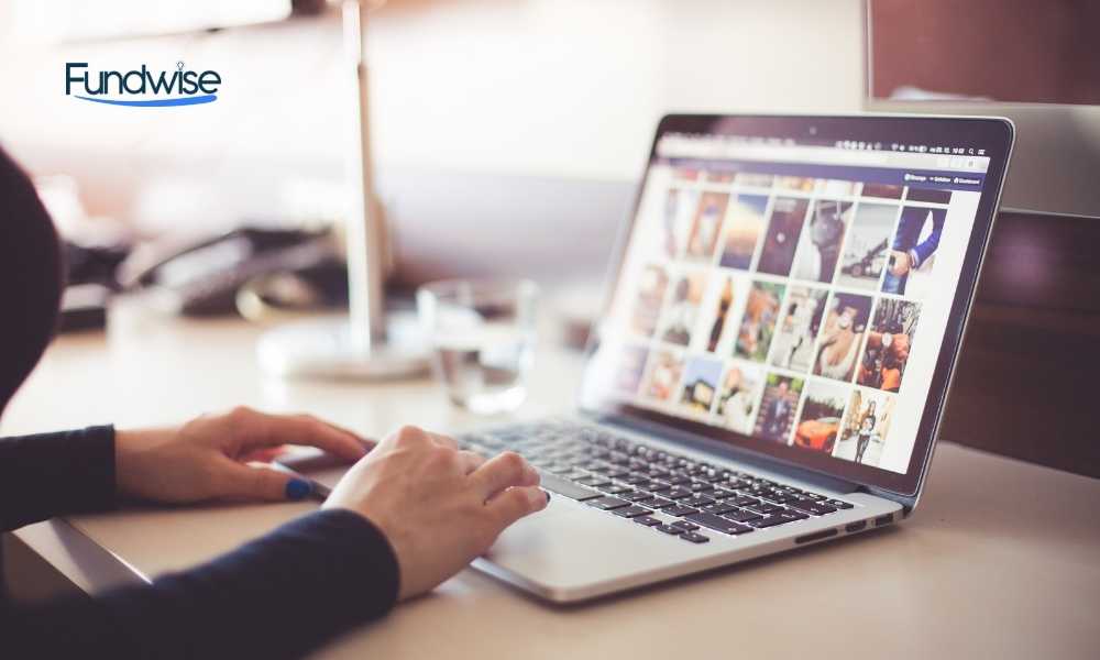 hand of a person checking his social media profile on laptop