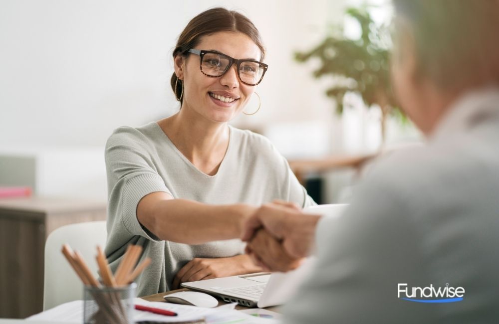 business owner shaking hands with a lender