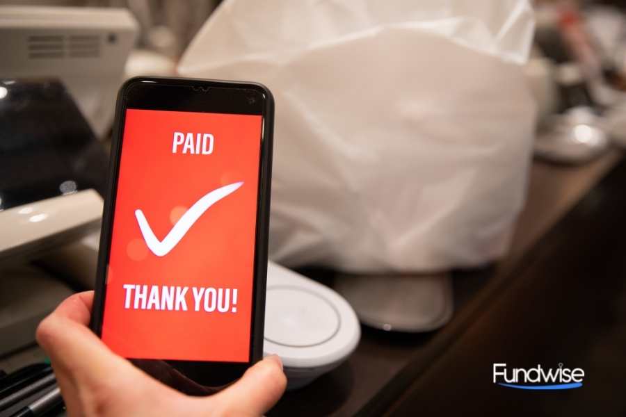 smart phone with "paid thank you" showing on screen